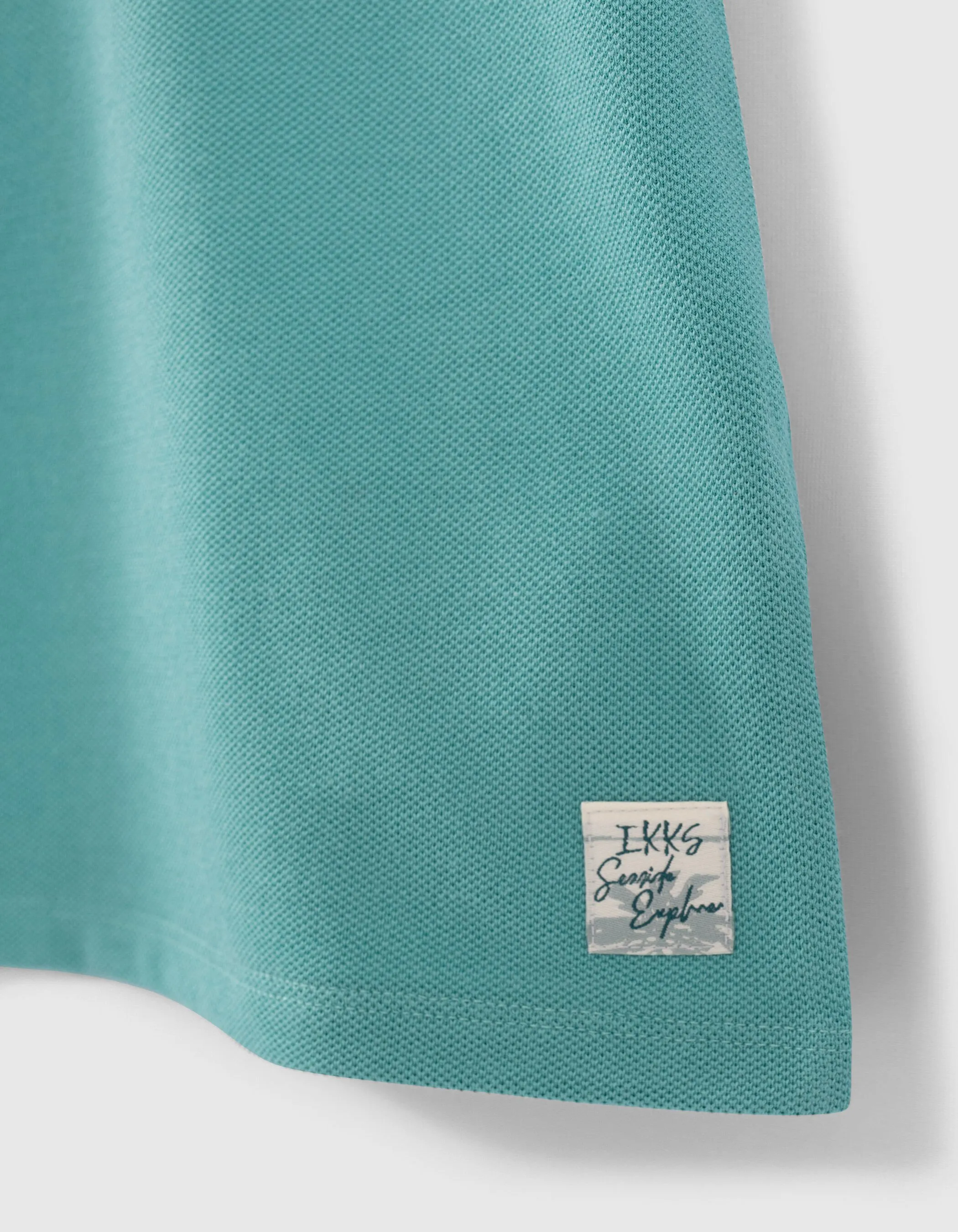 Polo turquoise col chemise trompe-l'oeil garçon