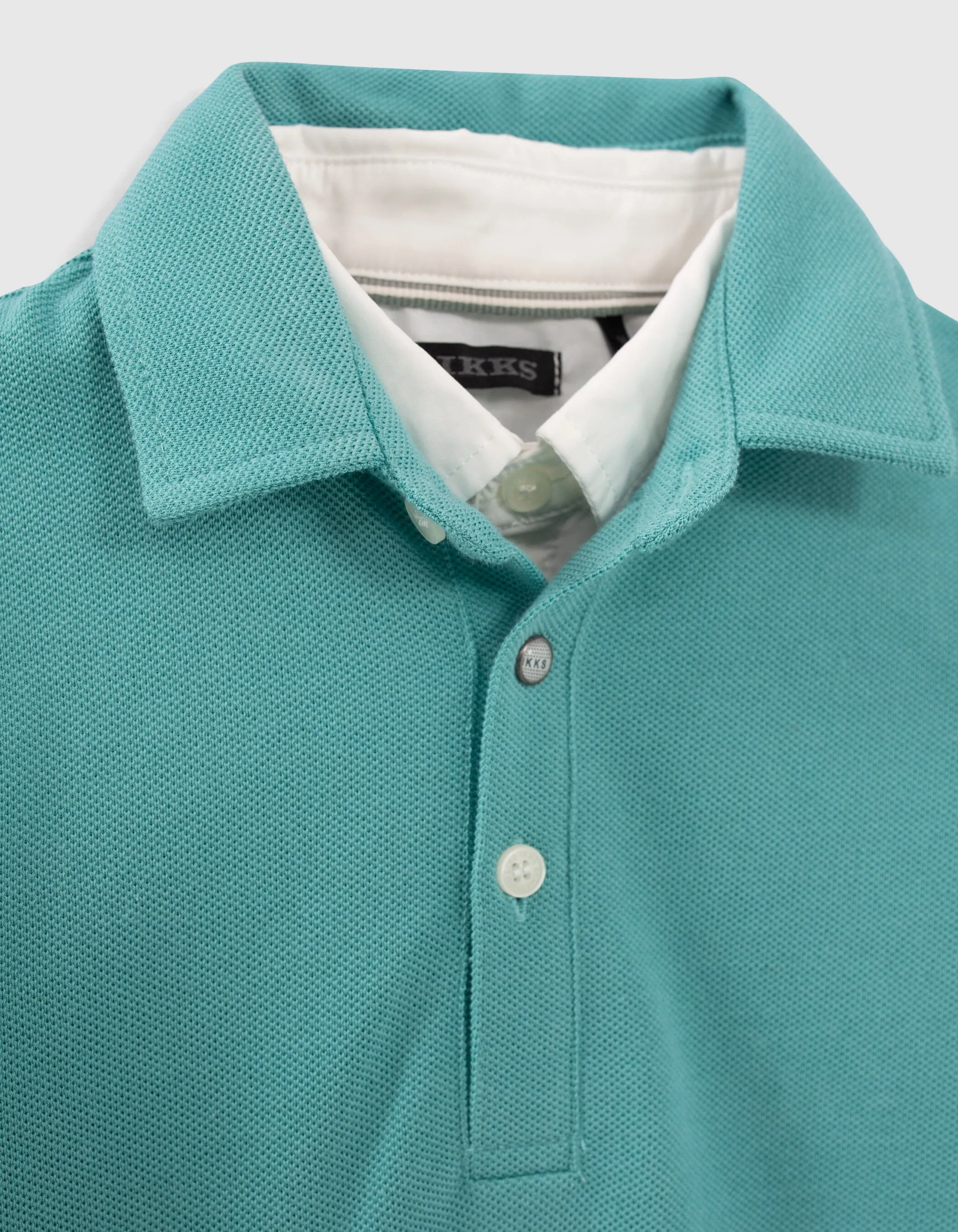 Polo turquoise col chemise trompe-l'oeil garçon